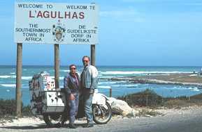Grant and Susan in front of sign at L'Agulhas, southenmost town in Africa