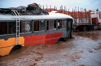 Bus on flooded Pan-Am Highway, northern Peru.