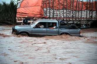 Trucks on flooded Pan-Am Highway, northern Peru.