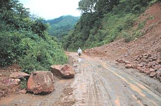 Grant on a very muddy road in Ecuador.