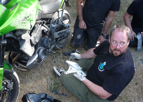 Crashed Kawasaki, broken footpeg hanger etc. Kevin bodged it and it worked to get him home!