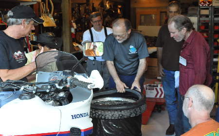 Grant's ever-popular tire-changing session at the HU North Carolina 2009 Meeting.