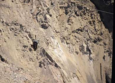 Britney on 2 km long wire over landslide at connection between Spiti and Kinnaur Valley, east of Manali, Himalayan Pradesh, near Tibet border.