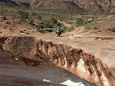 Following the edges of the White Rim, halfway up the canyon wall. Don't make any mistakes here.