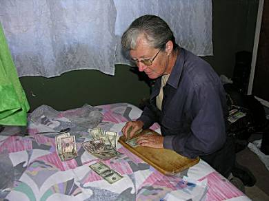 Money laundering? No, Kay trying to wash the mould off some wet US notes.