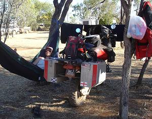 November: by Emma Myatt, UK; of Hamish Oag, UK; In Australia - after a hard day in the saddle Hamish Oag relaxes in the hammock next to our BMW R1100 GS.