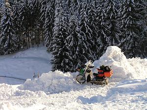 December: by Andy Gower, UK; End of the road at the Tauerntreffen, Hohentauern, Austria; Part of a 1900 mile European winter trip, Honda Cub C90.