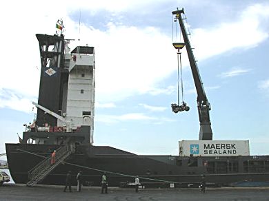 Loading the motorcycle with the large container crane.