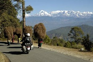 by Ingo Cordes, Germany; of Kathy and Murray Speirs (New Zealand), Riding in Uttaranchal (India) with views of the Himalayas, Royal Enfield.