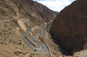 by Stefan Thiel, Germany, http://www.HorizonsUnlimited.com/redirects/stefanthiel.htm; View from the top rim into the Dades gorge in Morocco. Circling down are Giancarlo 'Carlo' Albrecht (Germany - Transalp) and Hajo Brunne (Germany - Africa Twin).