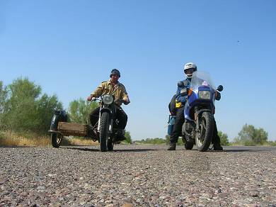 Turkmenistan -- This guy is just styling with his Ural.