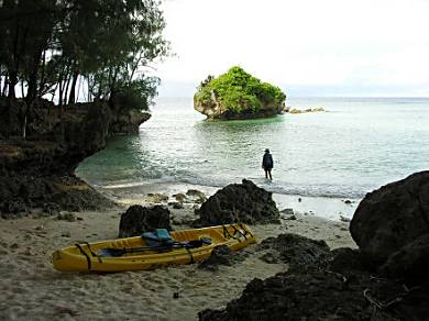 Kayaking to a private beach to snorkel on Carp Island, Palau.