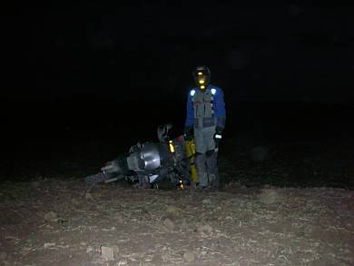 Looking for a camping site next to the road in remote areas in the dark is not advised. This is me waiting for some assistance after dropping the bike.