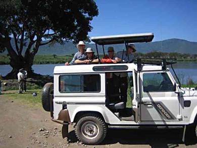 Motorcycle travellers Ekke andAudrey join newlyweds Christine and Will on the Amazing Race, Tanzania.