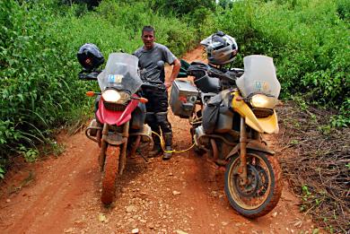 Mike's battery is acting up & we have to boost it via Ruby's motorcycle. A not very happy Mike.