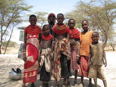 Locals and bike, Kenya.