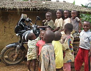 by Alan Whelan, UK; Kids on Tiger near Mamfe, Cameroon, trans-Africa trip - Lancashire to Cape Town; Triumph Tiger 955i.
