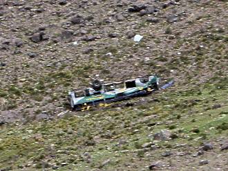 Wreck of the bus, clothes still blowing in the breeze where they caught on the shattered windows.