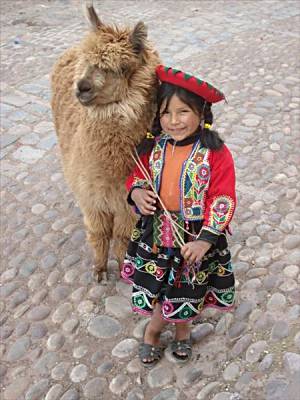 Tiny Peruvian girl and llama