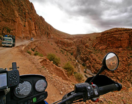by Stefan Cedergren, Sweden. The narrow and winding roads of Dades Gorge in Morocco. I better let the truck pass first or I may end up in the river. BMW R1150GS.