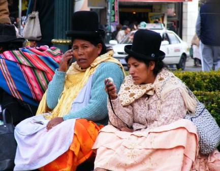Market vendors with cell phones, Bolivia.