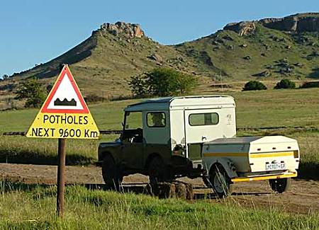 Potholes sign.