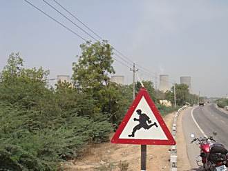 running pedestrian sign.
