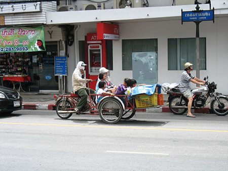 Thai family on bike.