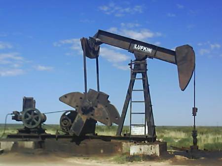 Nodding Donkey Oil Pump Sucking The Black Gold From The Ground in Texas.