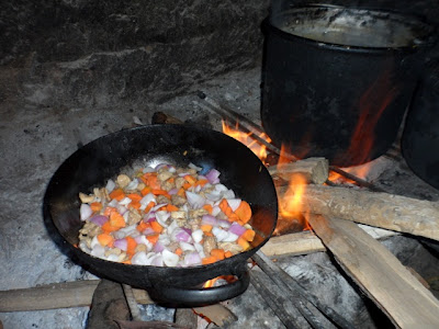 Chicken fried rice over open fire.