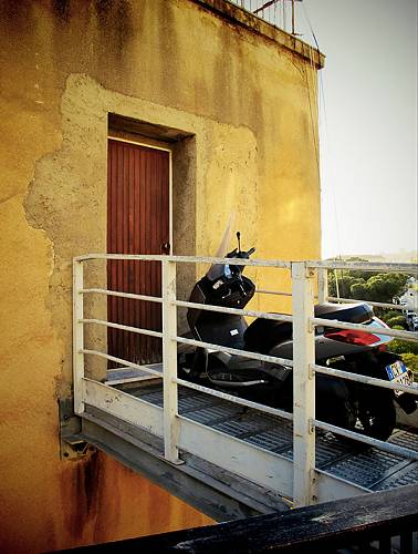 Bike parked outside, Sicily.