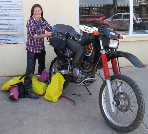 Tiffany Coates with bike when it was clean, Madagascar.