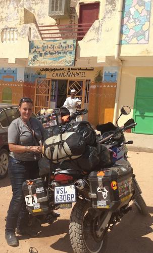 Jo Rust packing bike at hotel, Sudan.