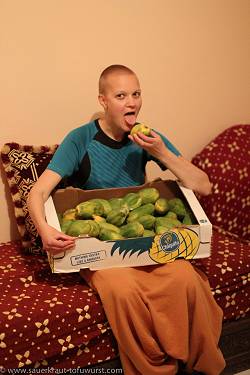 Ilta enjoying papayas from the market.