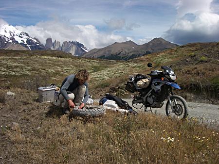 Alistair fixing a tire in an inconvenient place!