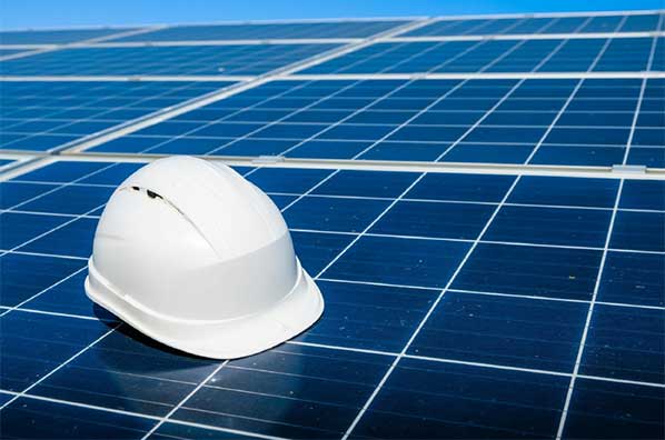 Hard hat on a solar panel