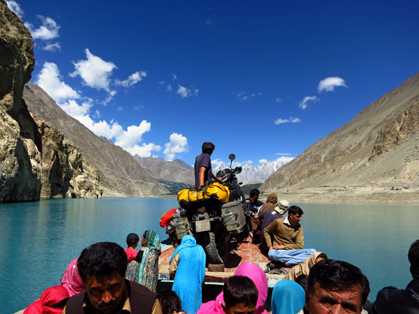 Marianne De Leeuw of  Maximilian Volders crossing Lake Attabad in Pakistan on our 3 year honeymoon trip, KTM 950 Adventure.