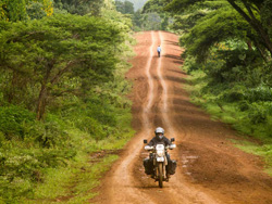 Photo by Danielle Murdoch (New Zealand) of Motomonkey Adventures riding to a small Kenya, Uganda border, hoping to avoid paying a Kenyan road tax on my Australia-to-Africa Adventure 2010-2014 DR350.
