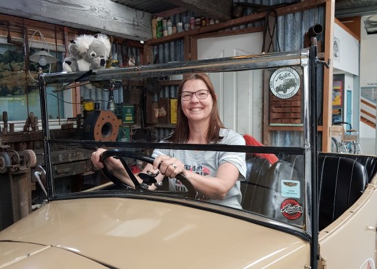 Lorraine Spence, behind the wheel of a heritage convertible.