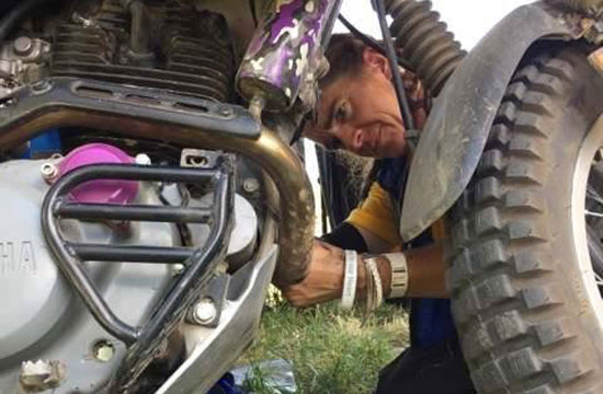 Ginamarie working on her bike.