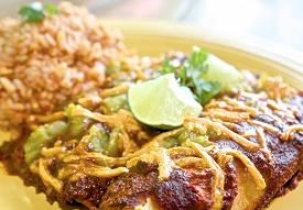 Enchiladas. Source: https://helynskitchen.com/2013/05/bean-enchiladas-and-mexican-rice-quick-red-enchilada-sauce.html