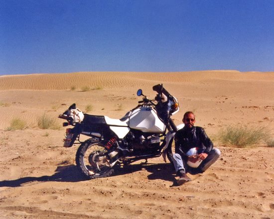 Sam Manicom, with his motorcycle in the Thar Desert, India.