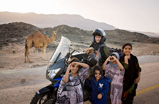 Rosie with kids and a camel