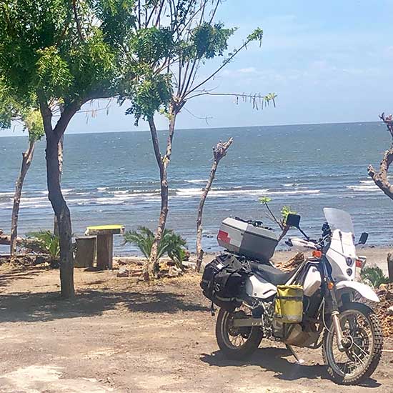 Motorcycle parked by the beach