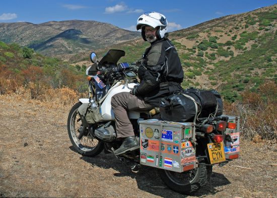 Sam Manicom, with his motorcycle, Libby.