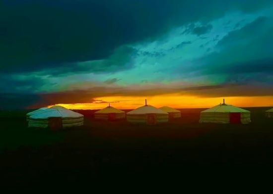 Delphine and Teddy Bachelin, Mongolian yurts and colourful sunset.