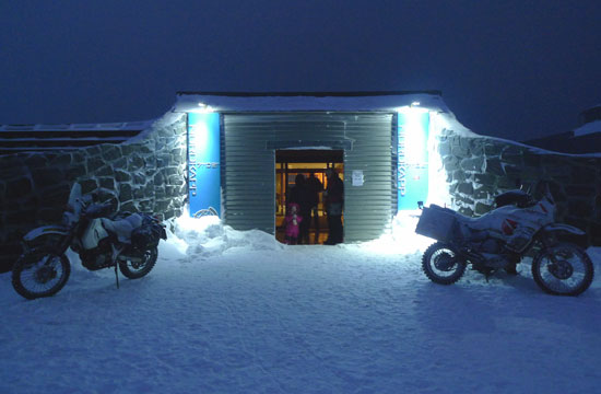 Bikes parked in the snow.