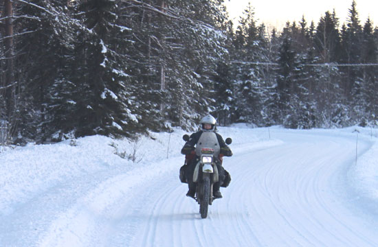 Riding on a snowy road.