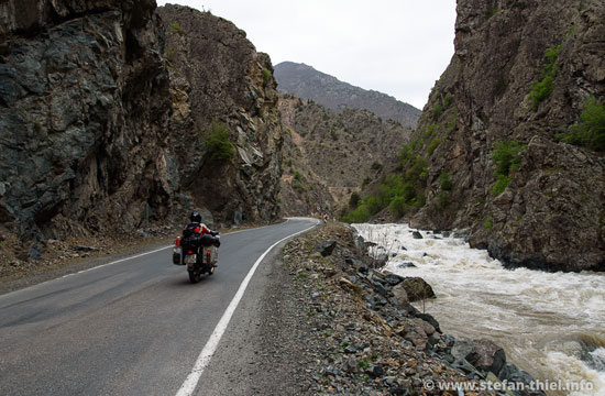 Stefan riding beside a river