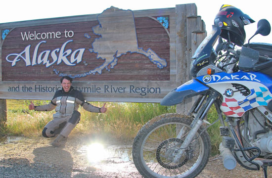 Alex with the Alaska welcome sign
